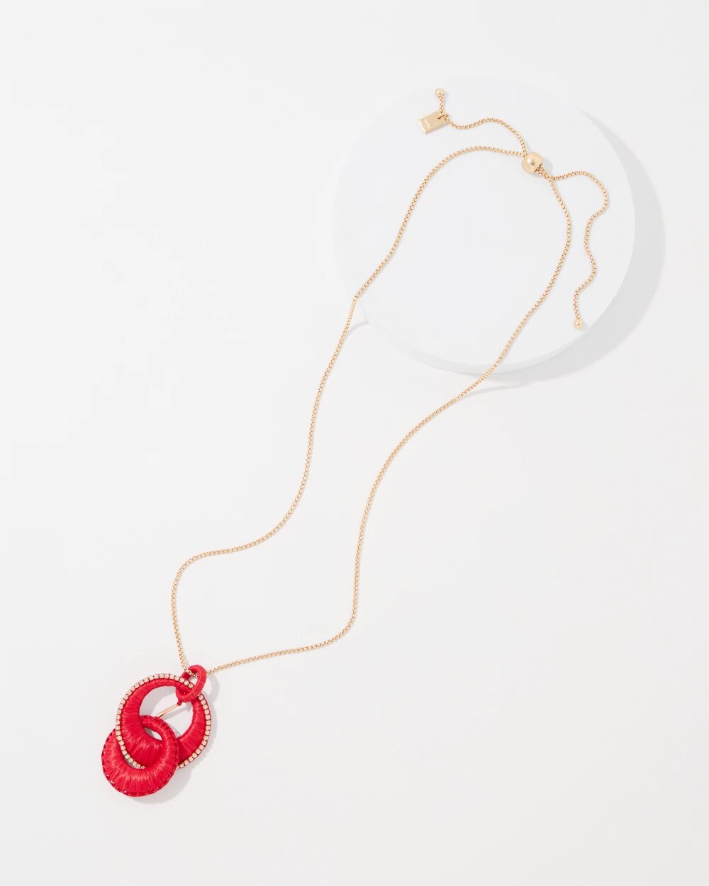 WHBM_NK20Red20Raffia20Pendant_570414228_RED007505_TT_ALT201.jpeg